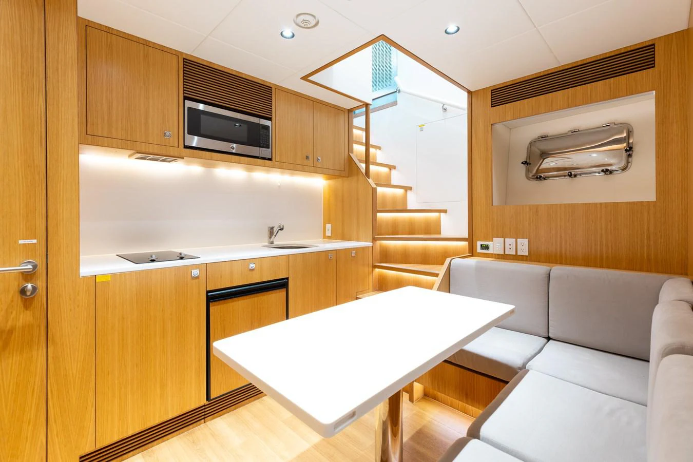 a living room with a couch and a table aboard ADAGIO Yacht for Sale