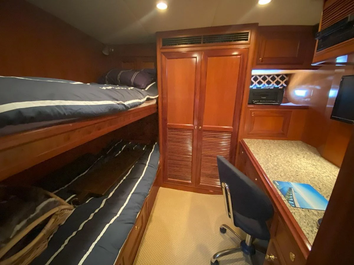 a room with bunk beds aboard TEMPUS FUGIT II Yacht for Sale