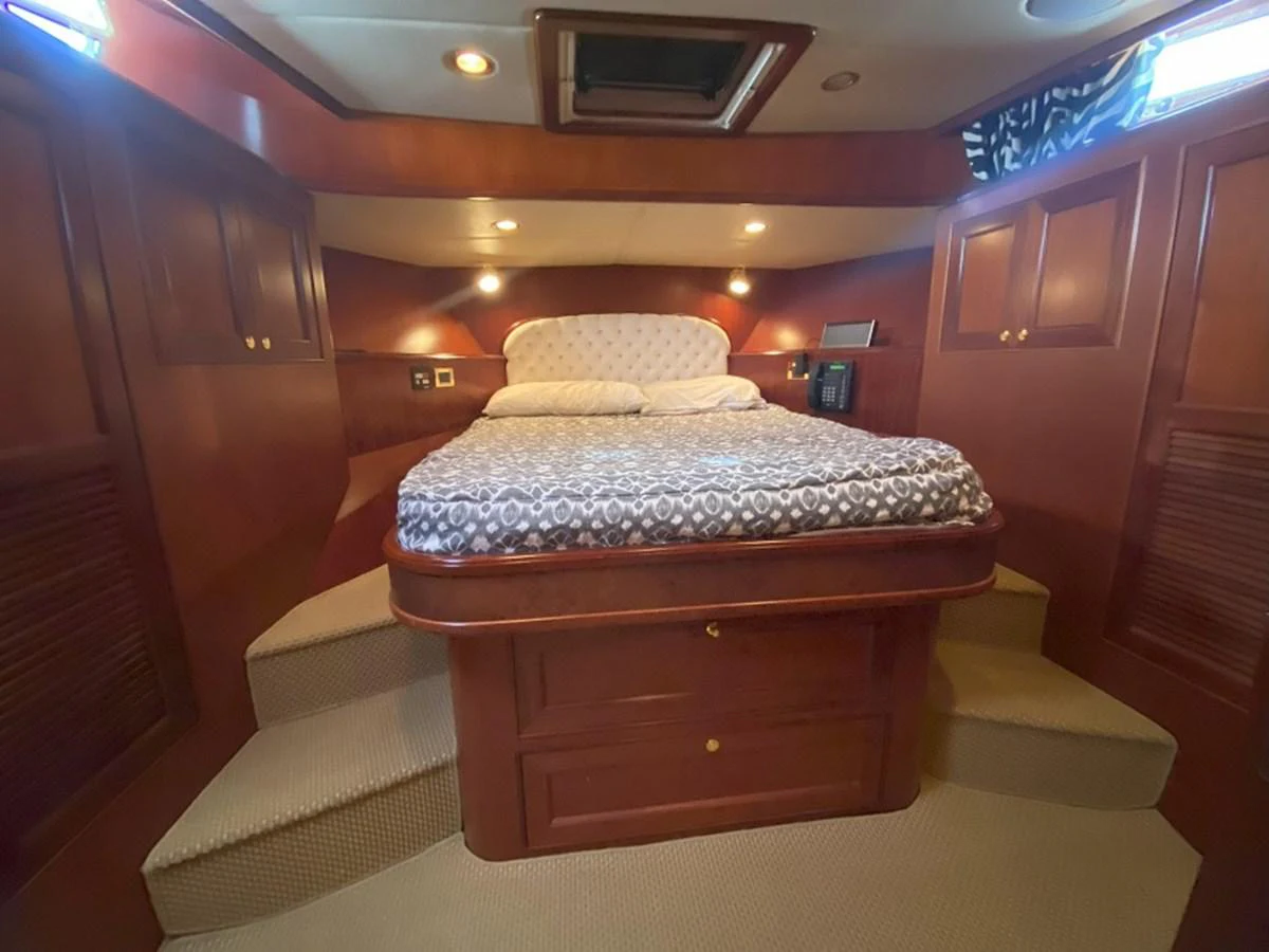 a bed in a room aboard TEMPUS FUGIT II Yacht for Sale