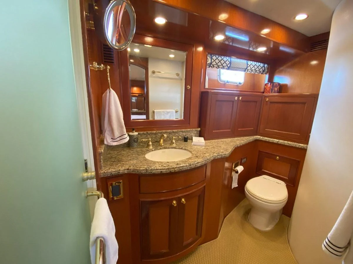 a bathroom with a large mirror aboard TEMPUS FUGIT II Yacht for Sale