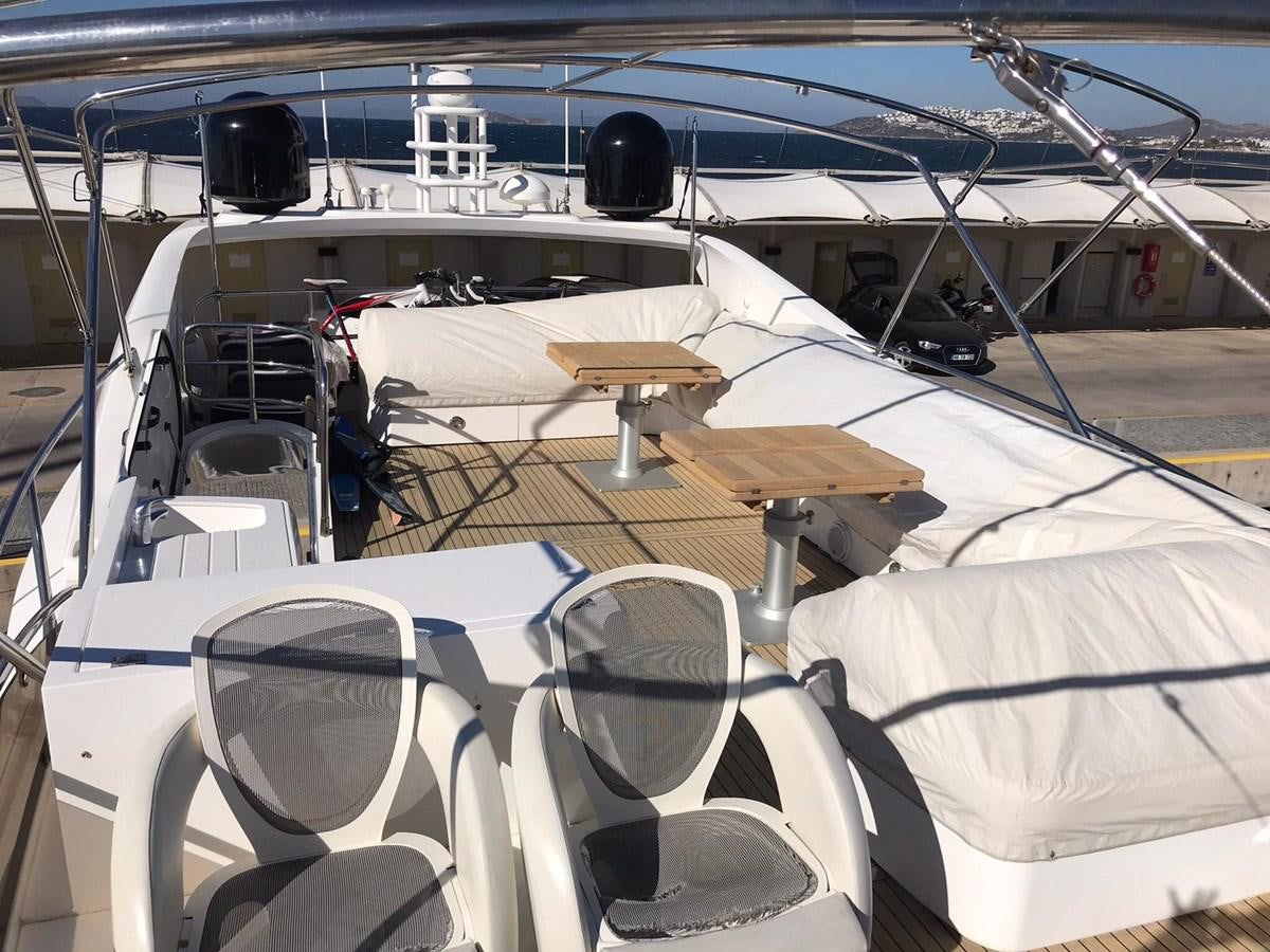 a boat with a table and chairs aboard MANHATTAN 70 Yacht for Sale