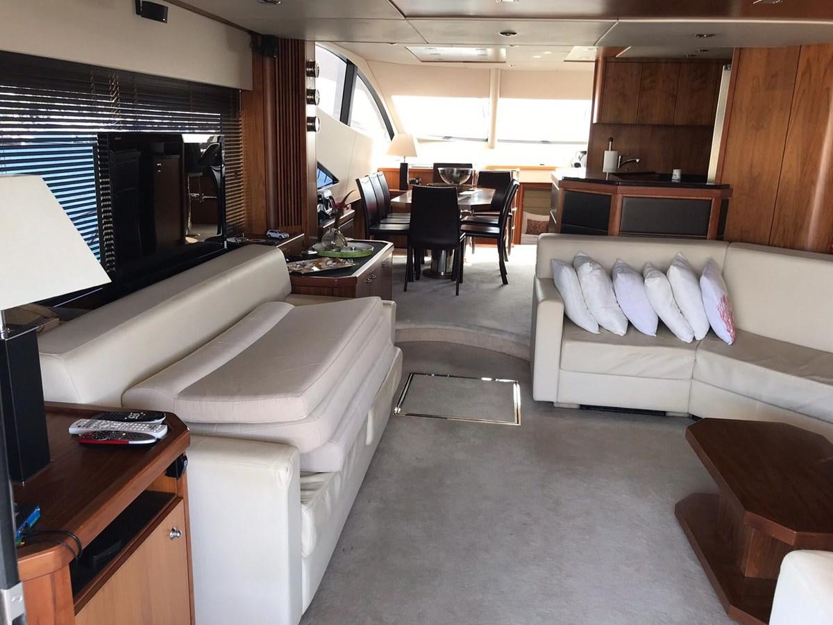a living room with a couch and a tv aboard MANHATTAN 70 Yacht for Sale
