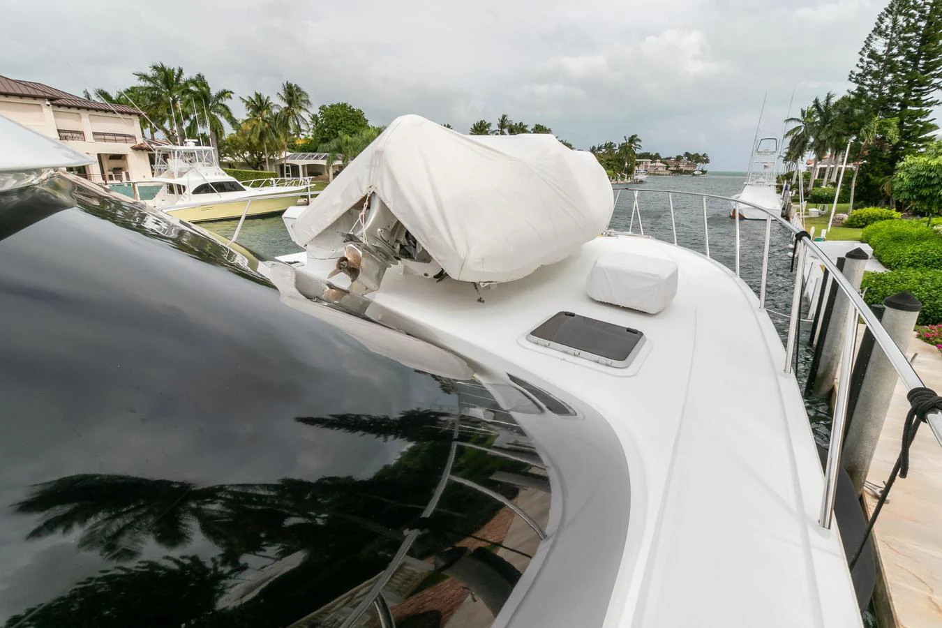 a white boat with a white cover aboard CHAIRMAN Yacht for Sale