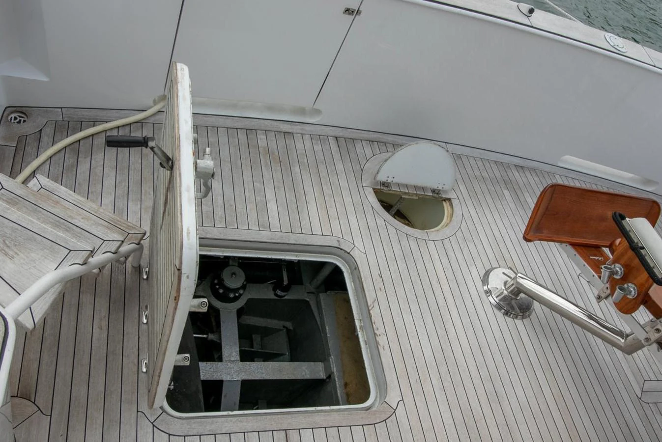 a white car with a door open aboard CHAIRMAN Yacht for Sale