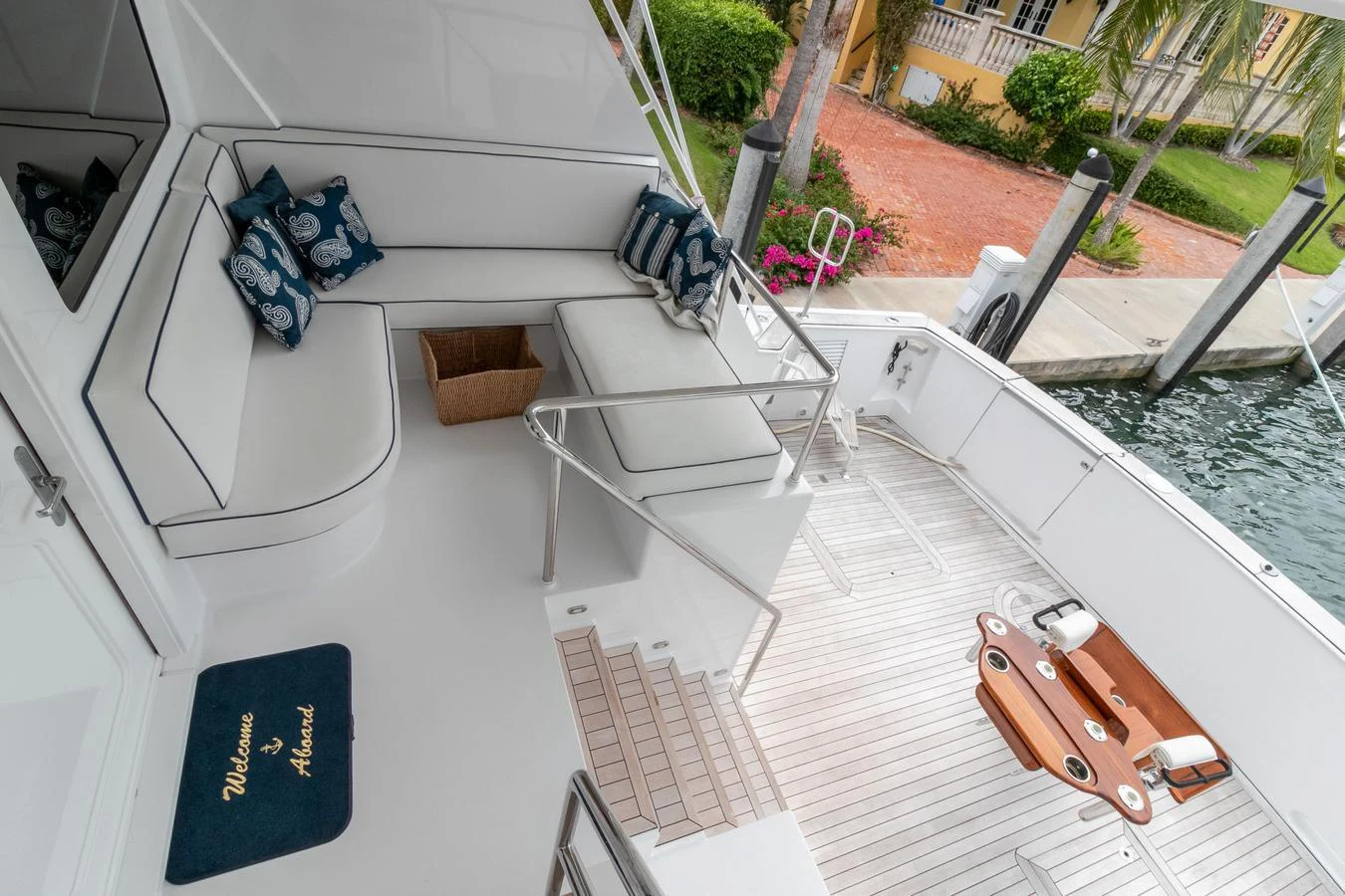 a balcony with a pool and a lawn with a lawn and a chair aboard CHAIRMAN Yacht for Sale