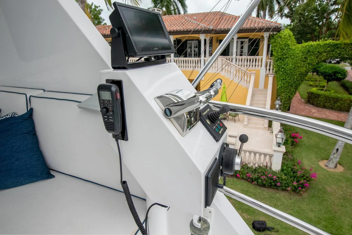 a white car with a black hood parked on grass in front of a house aboard CHAIRMAN Yacht for Sale