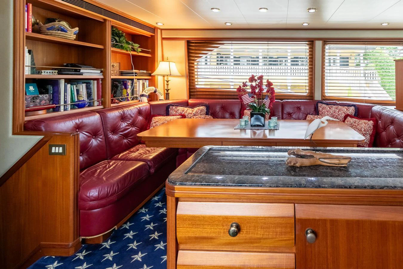 a living room with a coffee table aboard CHAIRMAN Yacht for Sale