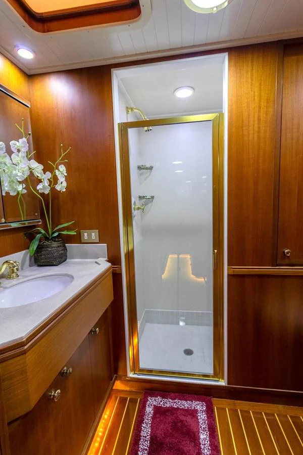 a bathroom with a glass shower aboard CHAIRMAN Yacht for Sale
