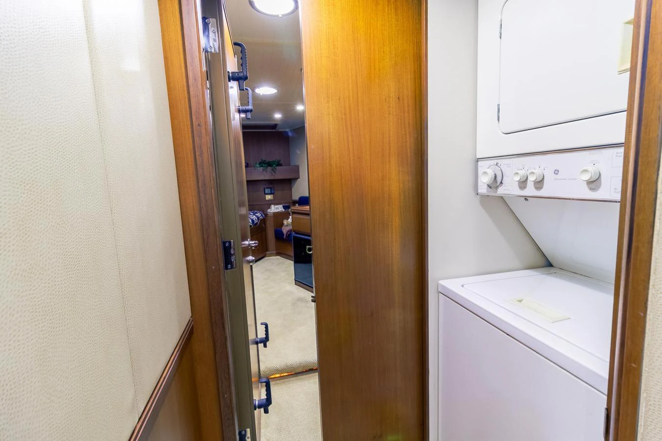a hallway with a washing machine aboard CHAIRMAN Yacht for Sale