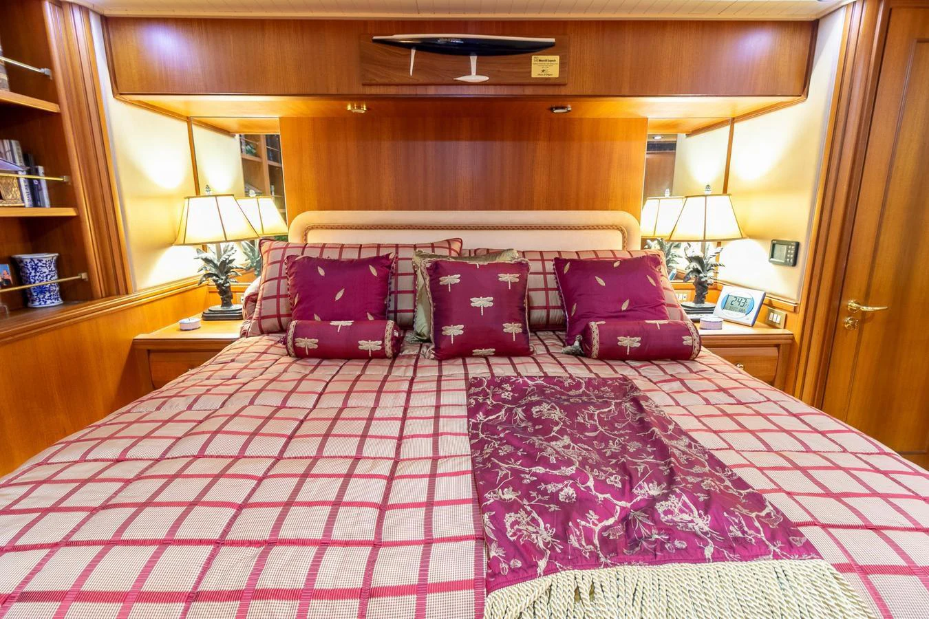 a bed with purple pillows aboard CHAIRMAN Yacht for Sale