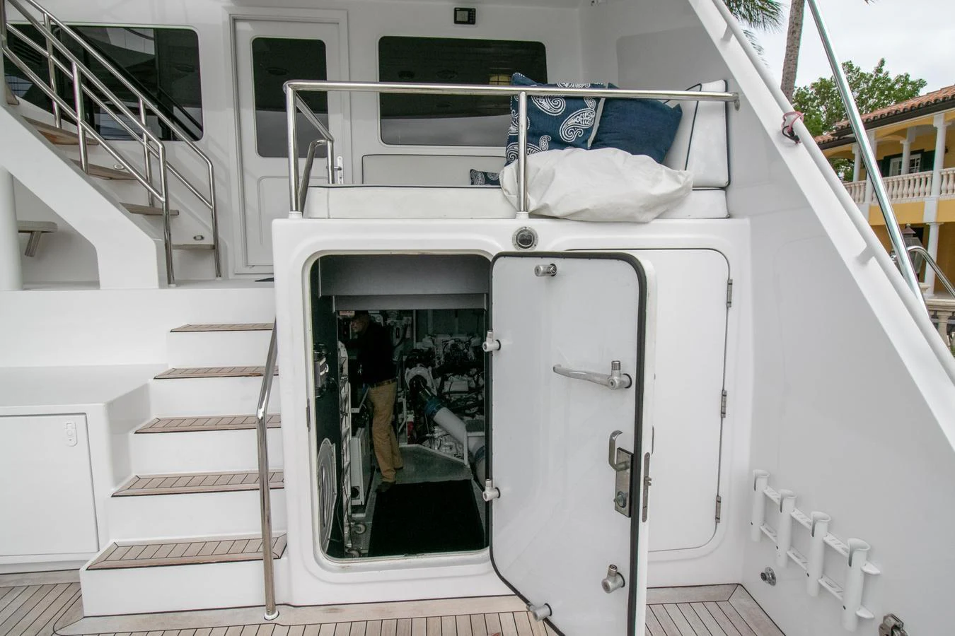 a person sitting in a white chair on a white boat aboard CHAIRMAN Yacht for Sale