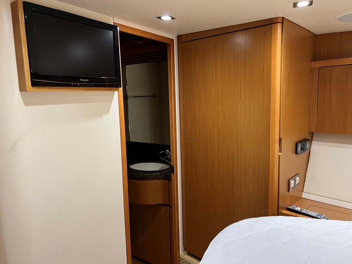 a tv on a wall aboard FORWARD Yacht for Sale