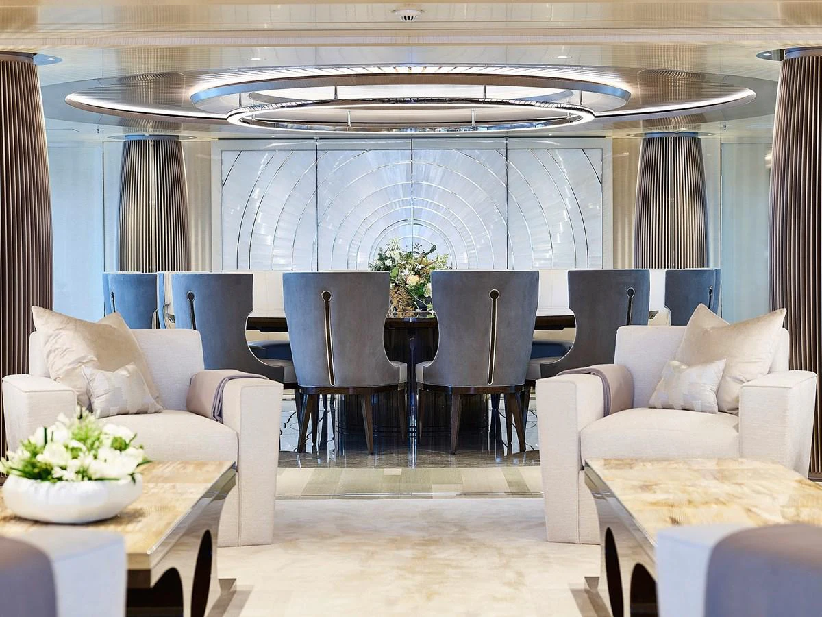 a room with a table chairs and a couch aboard NEW SECRET Yacht for Sale