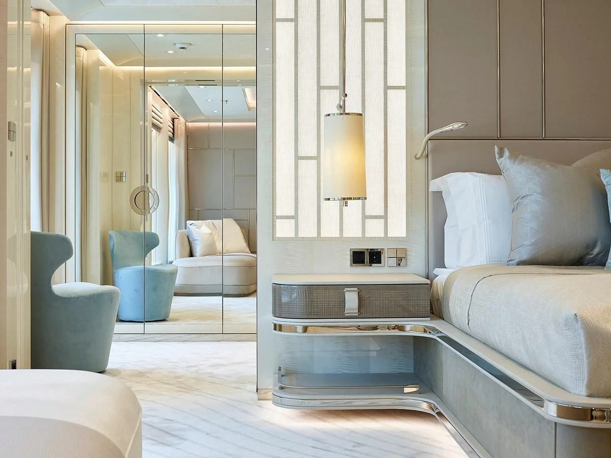 a room with a bed and a chair aboard NEW SECRET Yacht for Sale