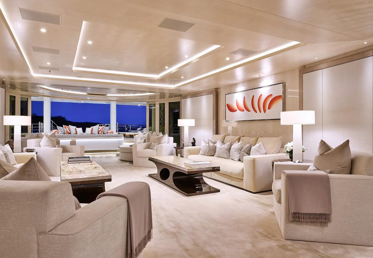 a large living room with white furniture aboard NEW SECRET Yacht for Sale