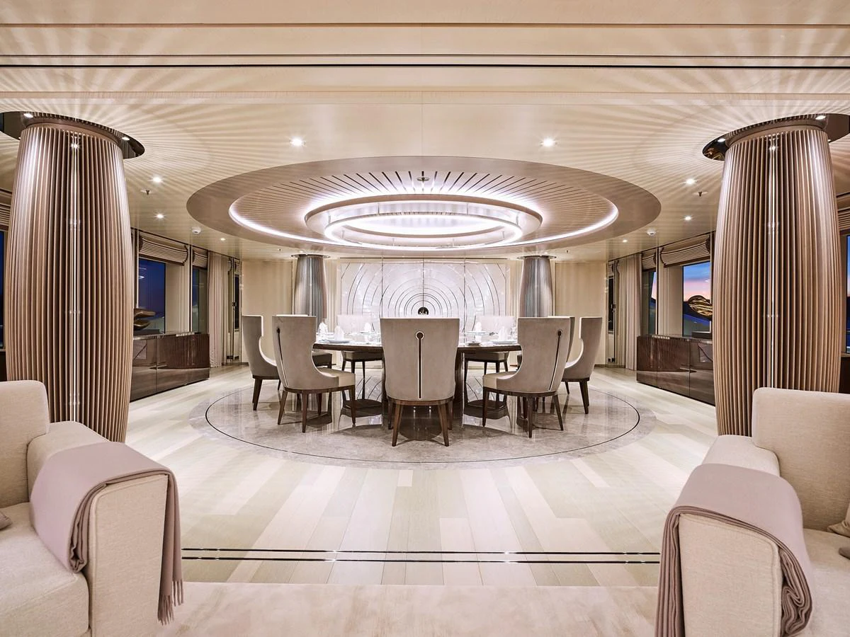 a large room with a table and chairs aboard NEW SECRET Yacht for Sale