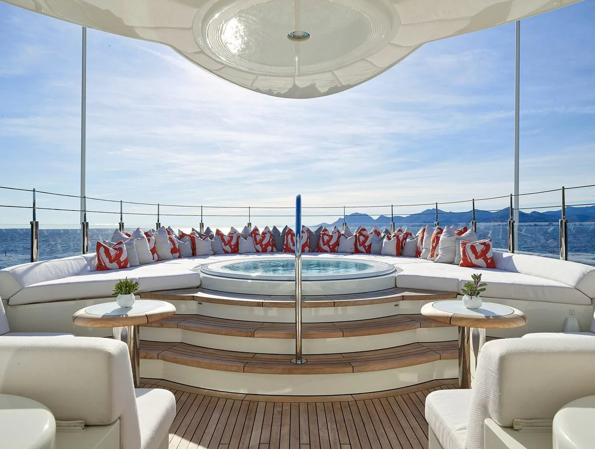 a large group of flags from a roof over a table aboard NEW SECRET Yacht for Sale