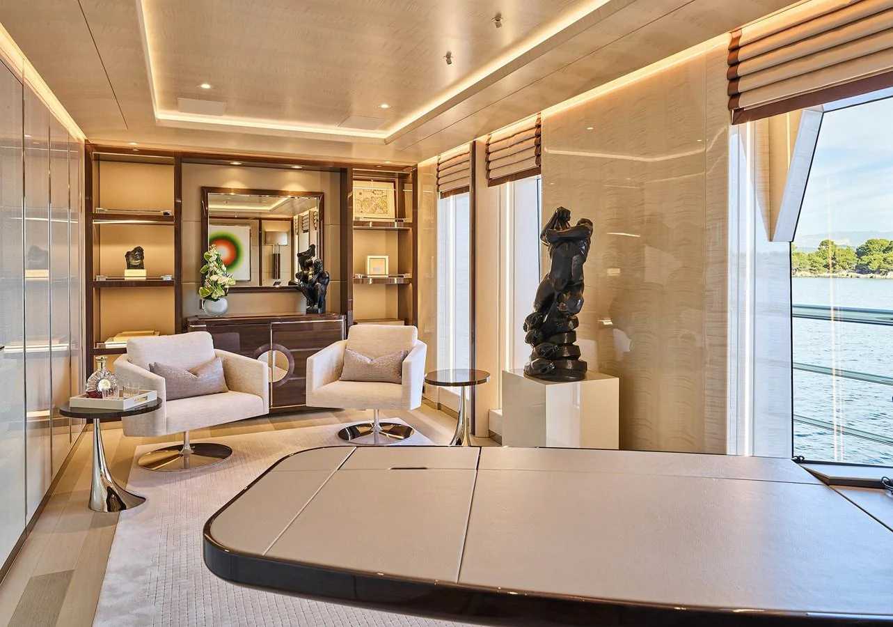a large living room with a statue aboard NEW SECRET Yacht for Sale