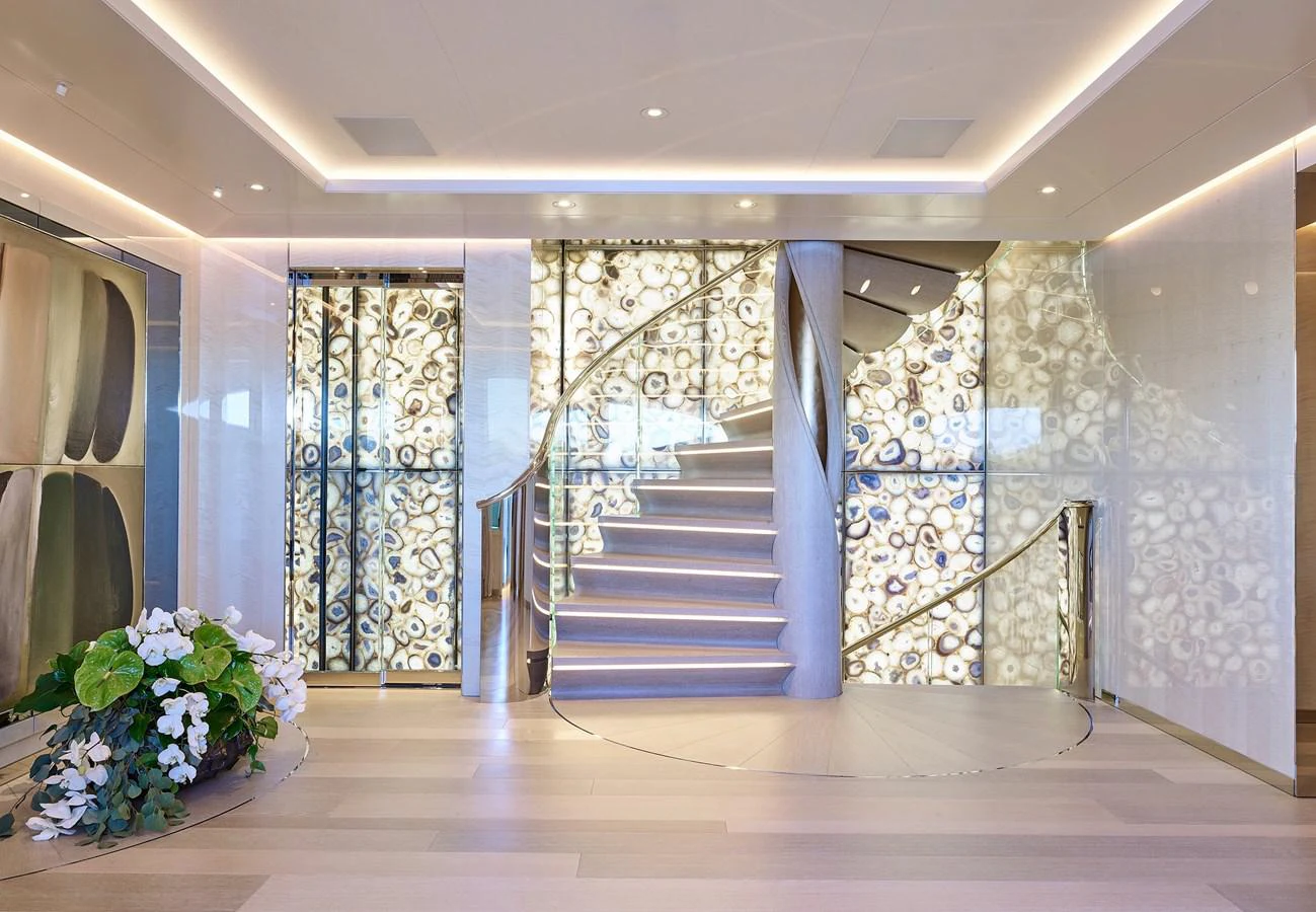 a room with a staircase and flowers aboard NEW SECRET Yacht for Sale