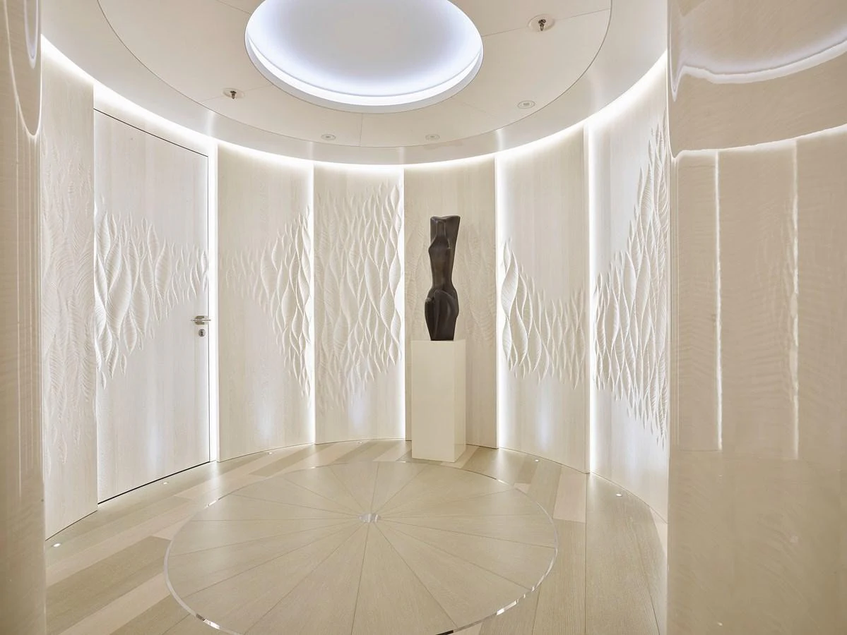 a white room with a chandelier and a white wall aboard NEW SECRET Yacht for Sale