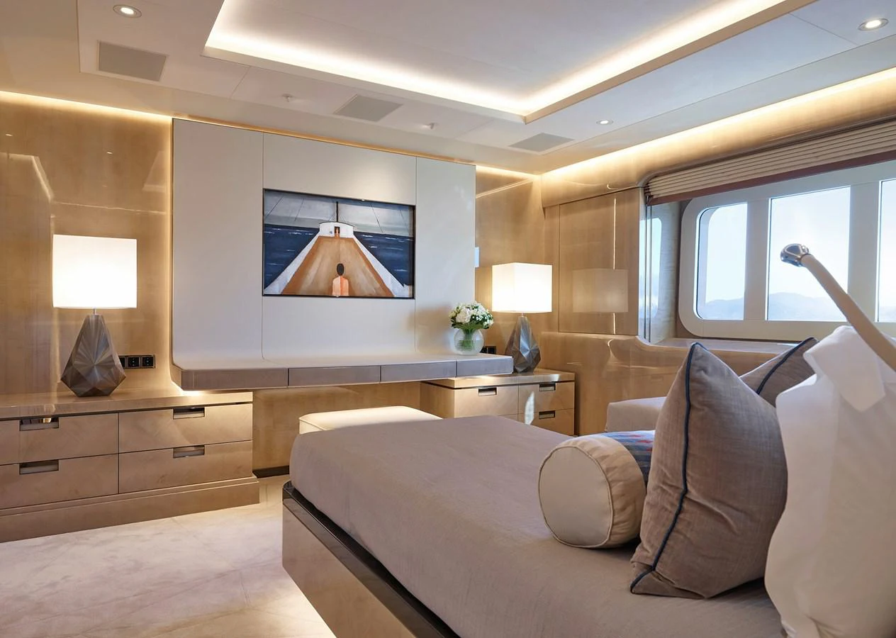 a room with a bed and a desk aboard NEW SECRET Yacht for Sale