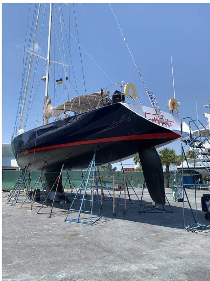 a boat on a dock aboard FORTUNATO Yacht for Sale