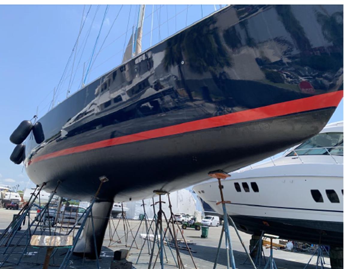 a large red and white boat aboard FORTUNATO Yacht for Sale