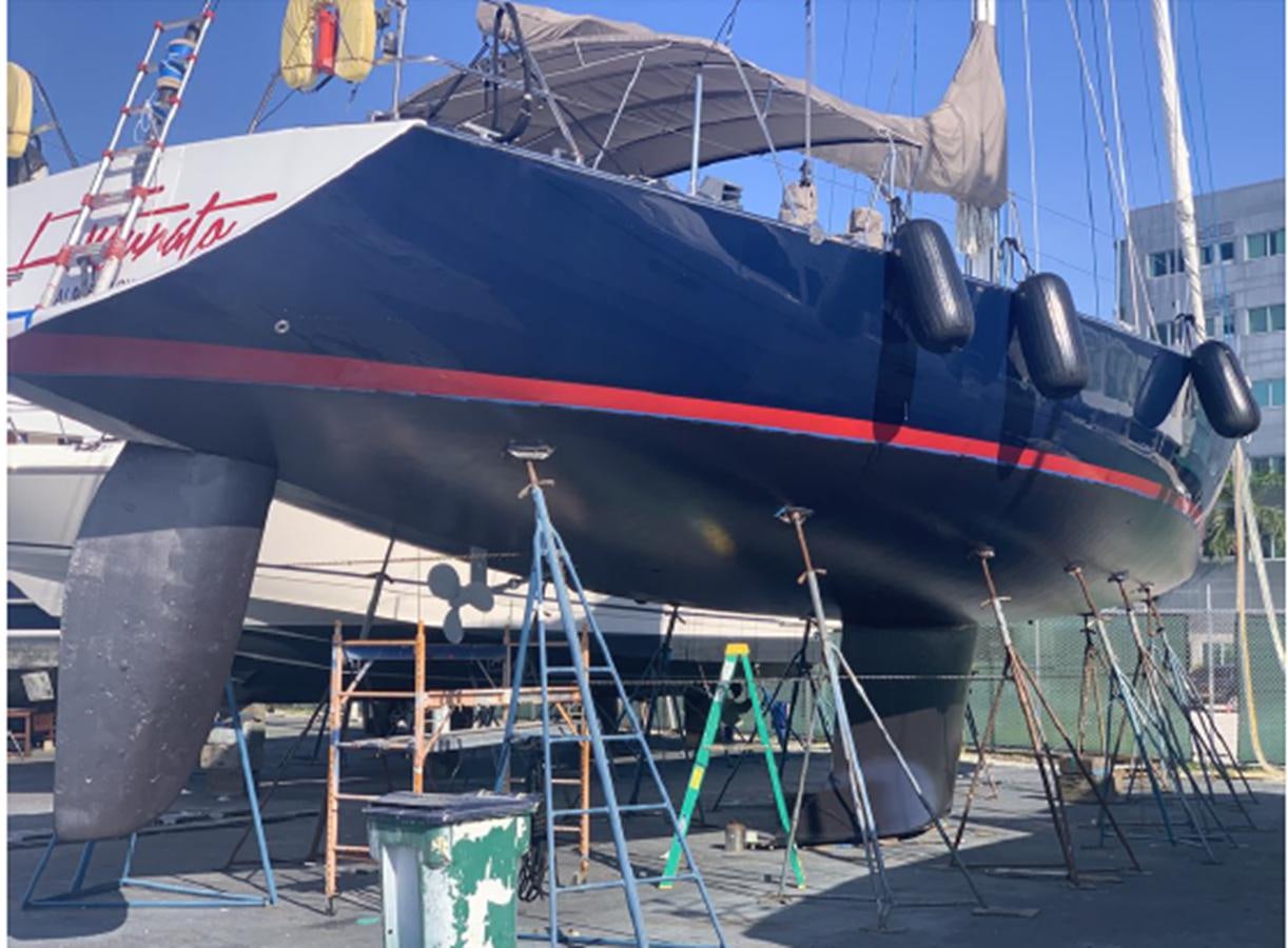 a large red and black boat aboard FORTUNATO Yacht for Sale
