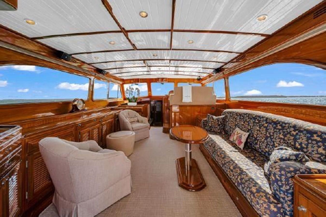 a living room with a large window aboard TRUANT Yacht for Sale