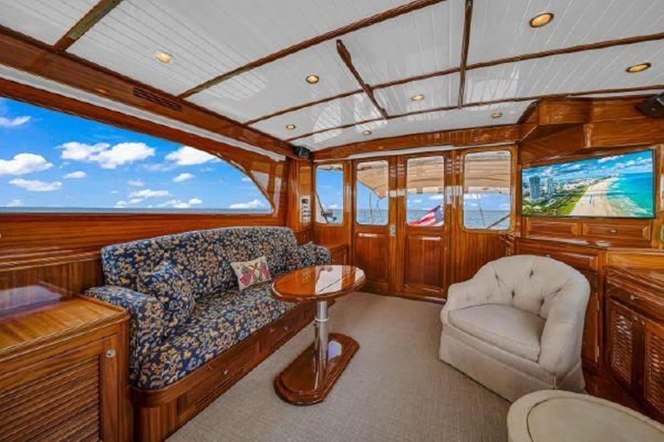 a cabin with a bed and a couch aboard TRUANT Yacht for Sale