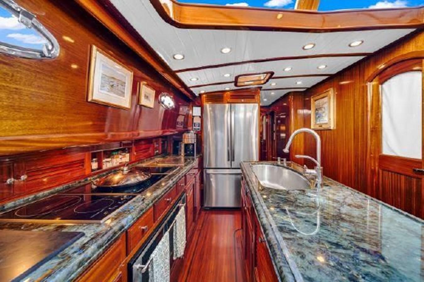 a kitchen with a large island aboard TRUANT Yacht for Sale