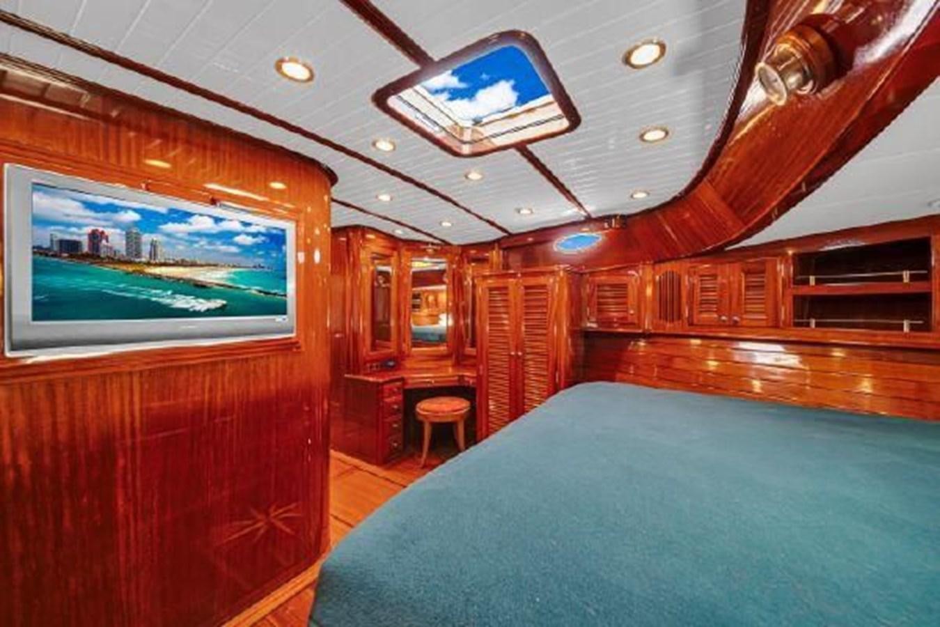 a room with a pool table and chairs aboard TRUANT Yacht for Sale