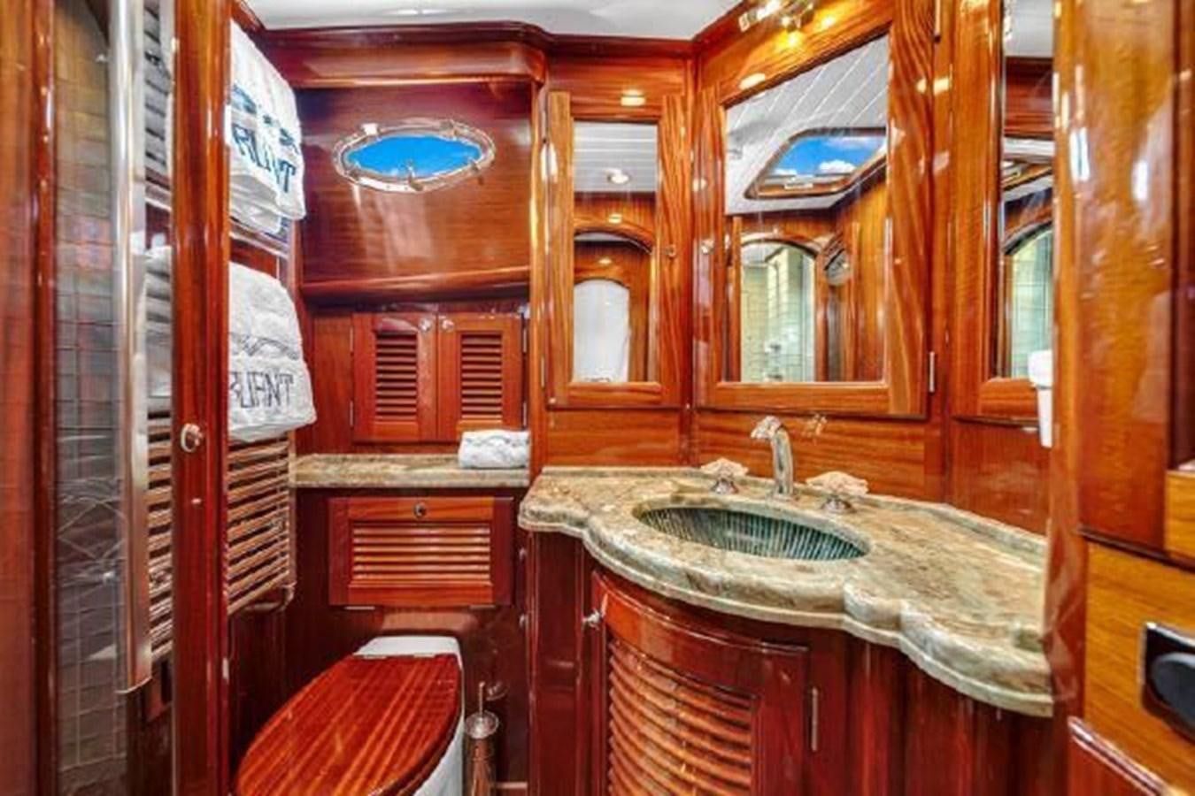 a bathroom with a sink and cabinets aboard TRUANT Yacht for Sale