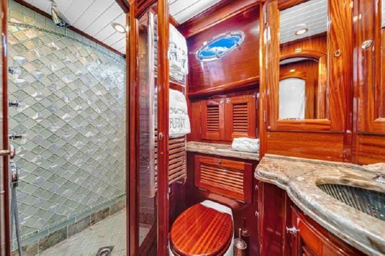 a bathroom with a sink and cabinets aboard TRUANT Yacht for Sale
