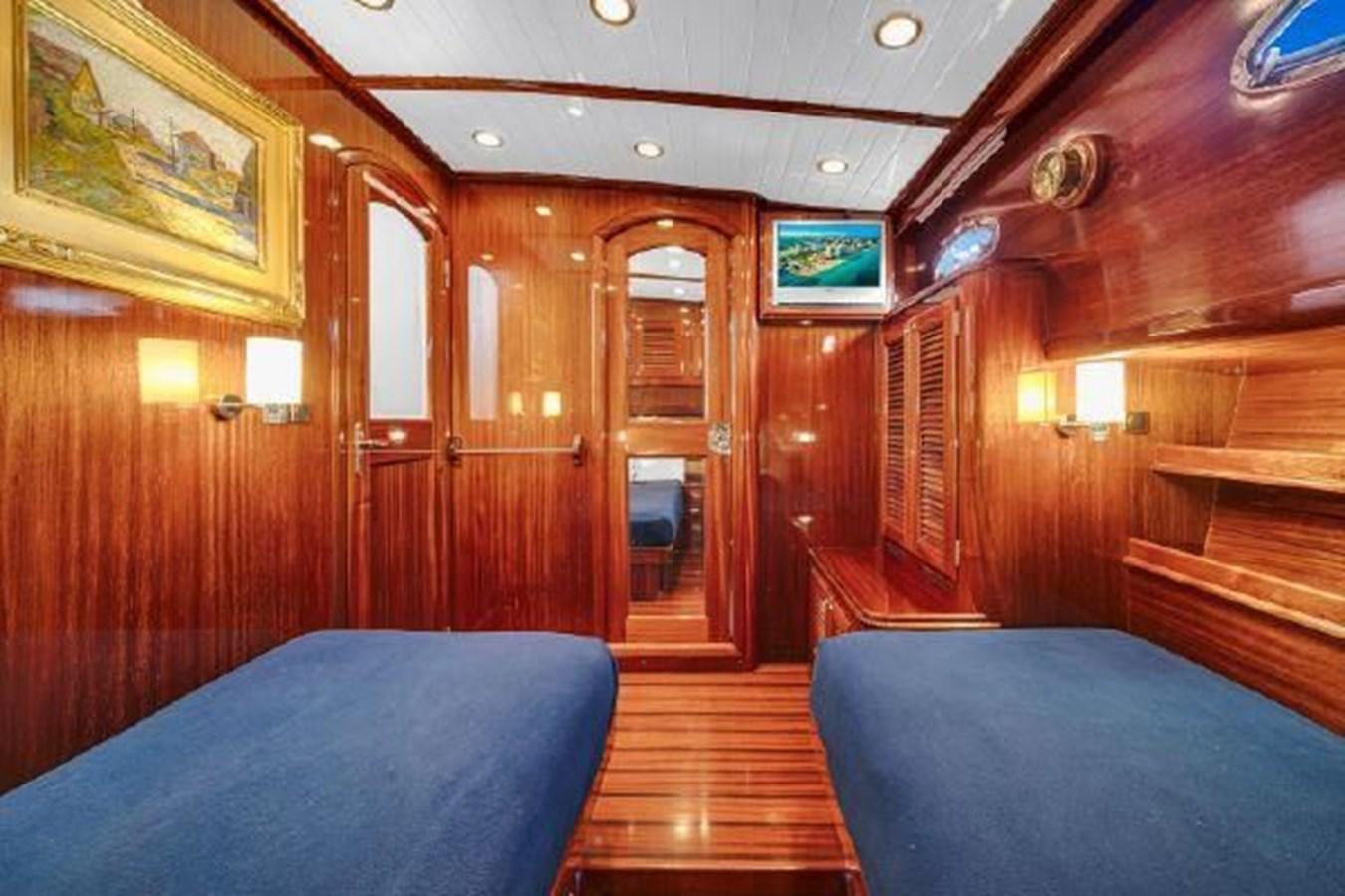 a cabin with a bed aboard TRUANT Yacht for Sale