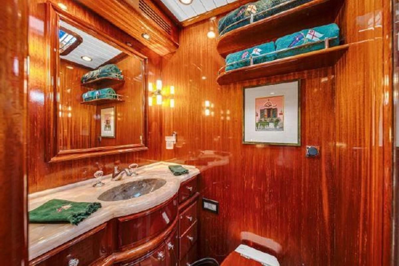 a bathroom with a sink and a mirror aboard TRUANT Yacht for Sale