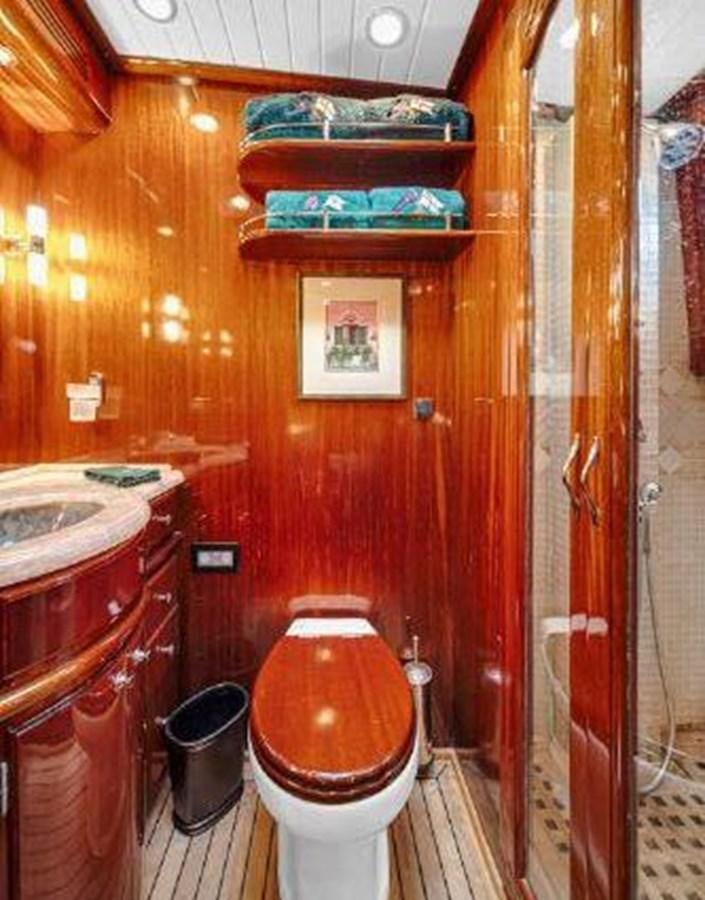 a toilet with wooden walls aboard TRUANT Yacht for Sale