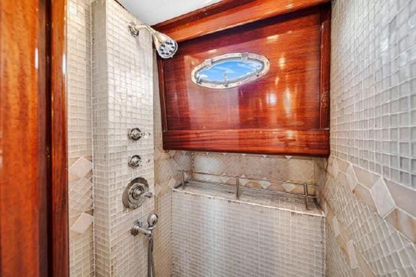 a bathroom with a glass window aboard TRUANT Yacht for Sale