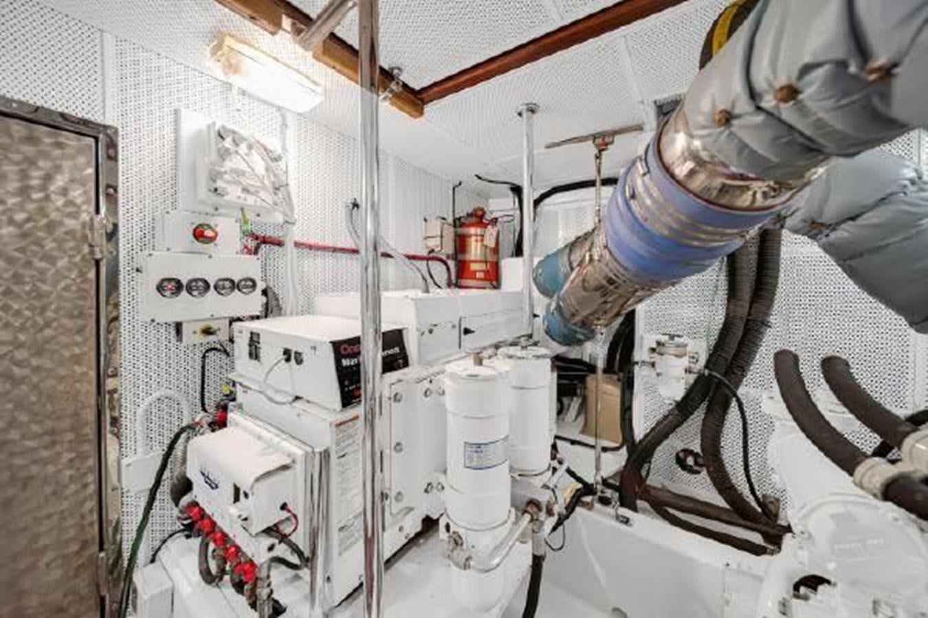 a person working on a machine aboard TRUANT Yacht for Sale