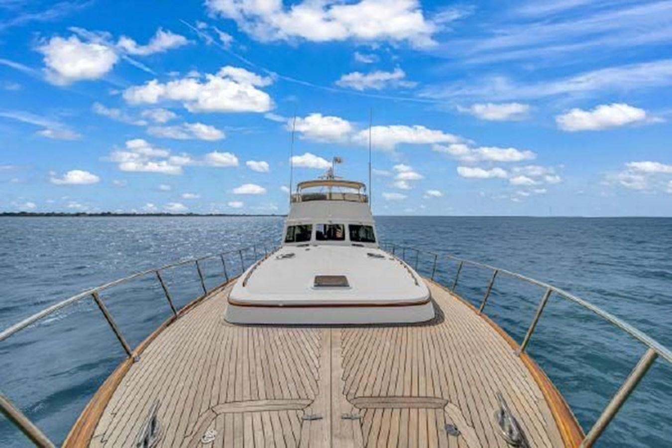 a white boat on a dock aboard TRUANT Yacht for Sale