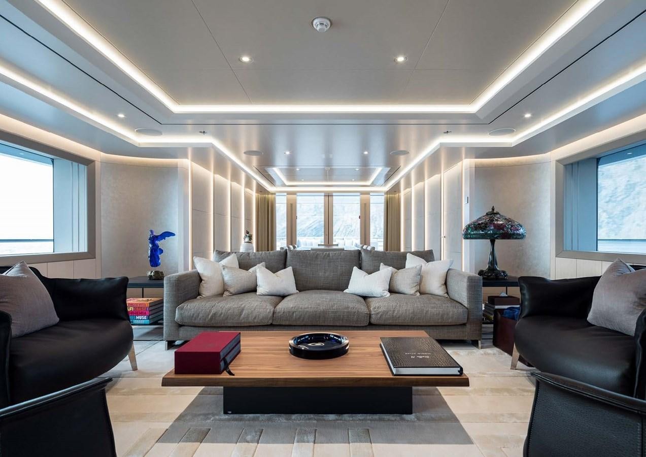 a living room with a couch and a coffee table aboard STELLA MI Yacht for Sale
