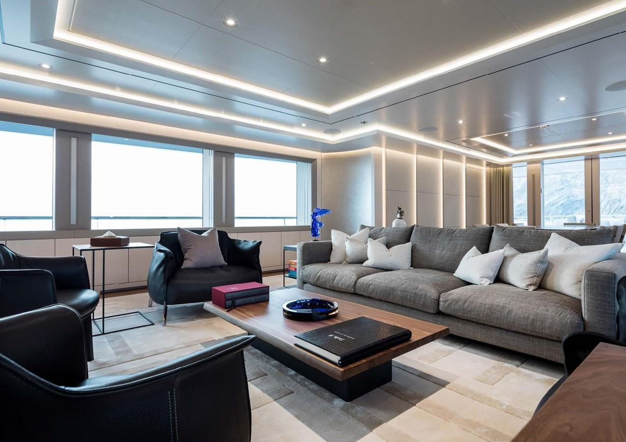 a living room with a couch and a coffee table aboard STELLA MI Yacht for Sale