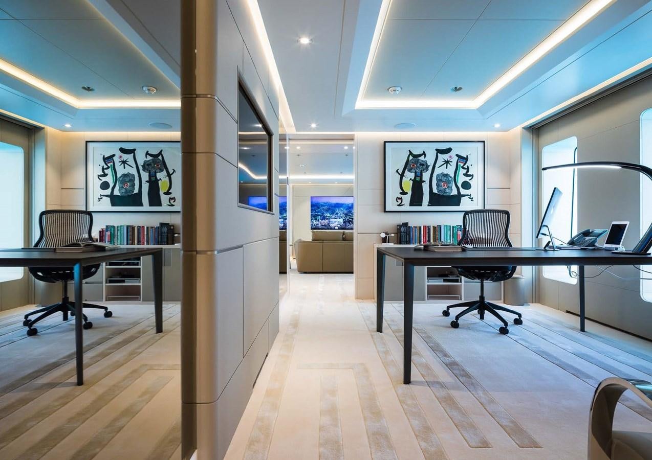 a room with tables and chairs aboard STELLA MI Yacht for Sale