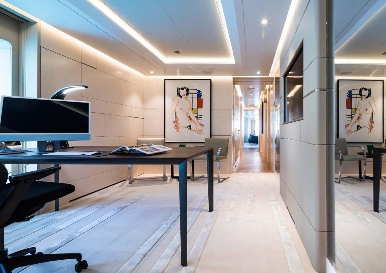 a room with tables and chairs aboard STELLA MI Yacht for Sale