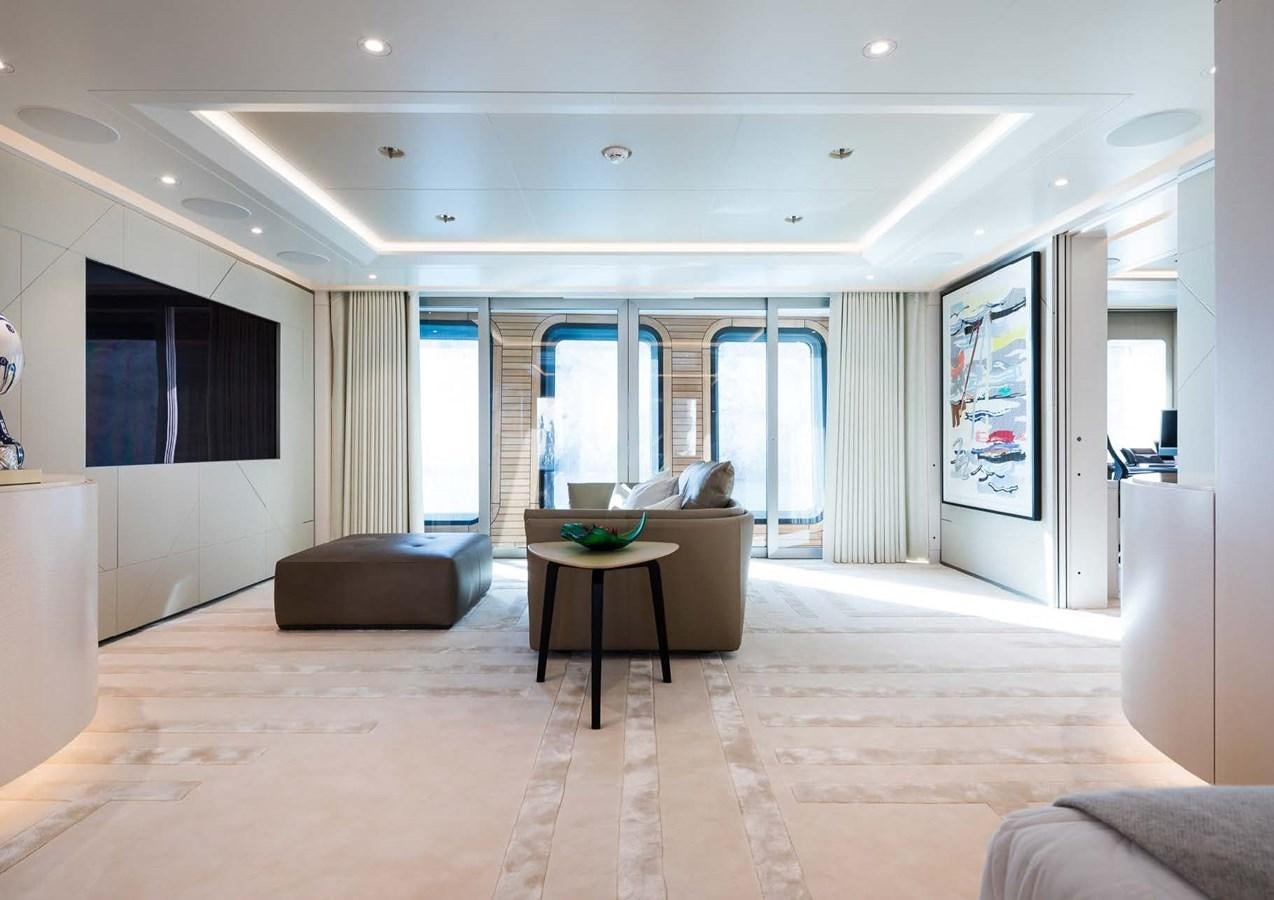 a living room with a large window aboard STELLA MI Yacht for Sale