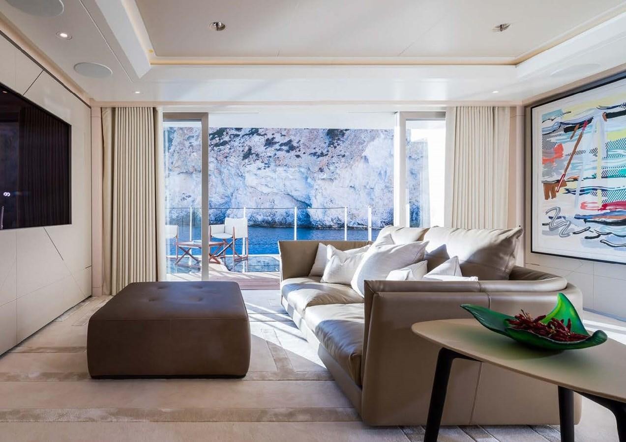 a living room with a large window aboard STELLA MI Yacht for Sale