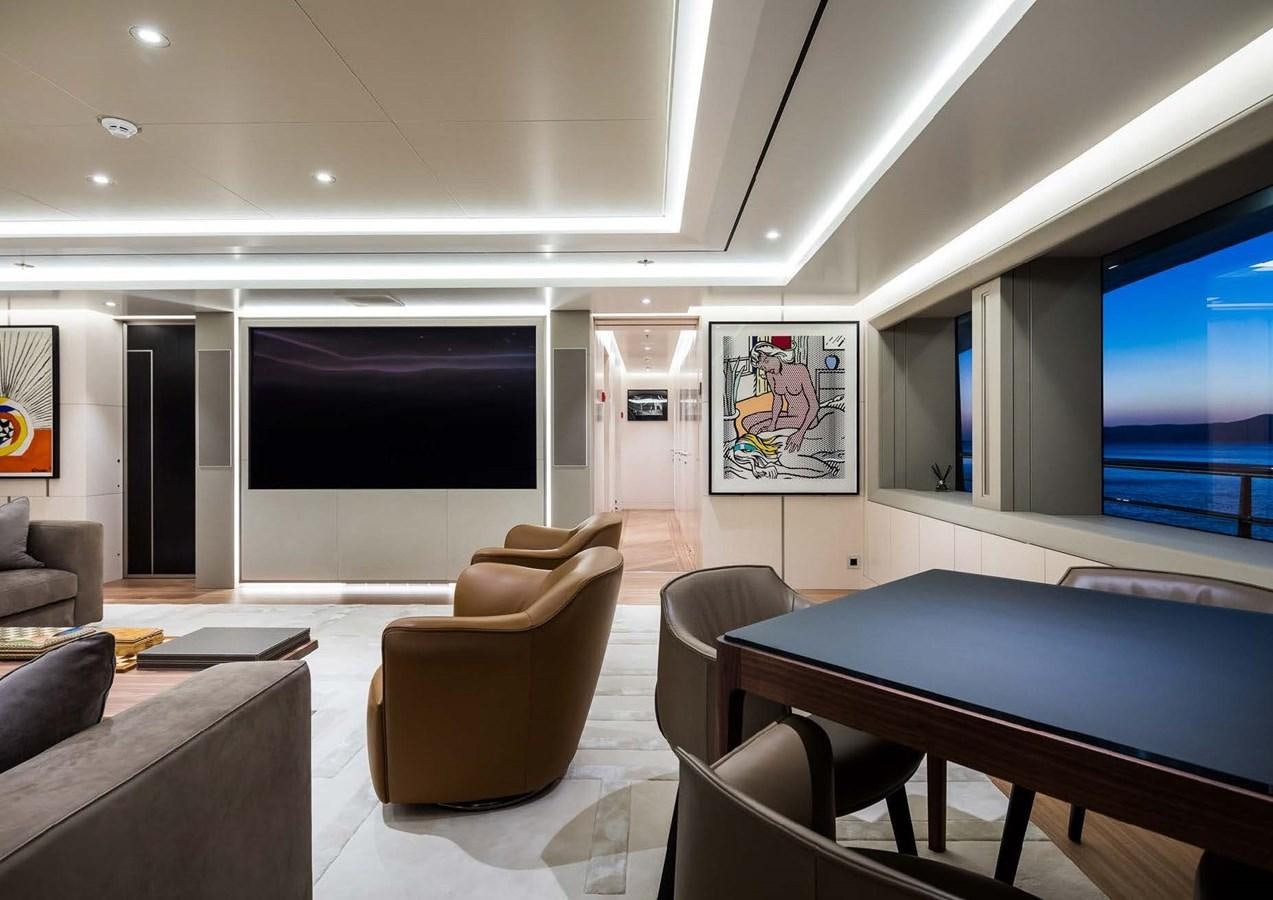 a room with a table and chairs aboard STELLA MI Yacht for Sale