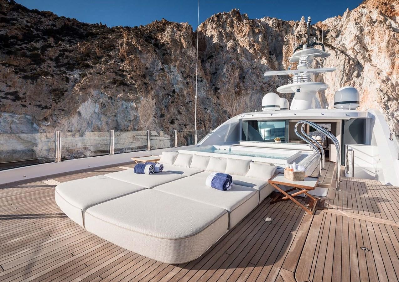 a boat on a deck with Hoover Dam in the background aboard STELLA MI Yacht for Sale