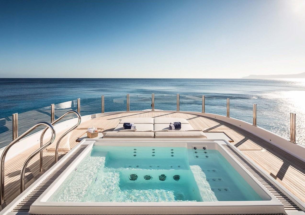 a pool on a deck overlooking the ocean aboard STELLA MI Yacht for Sale