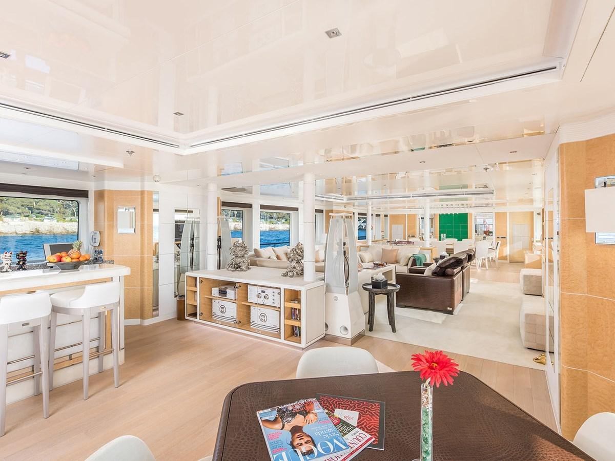 a living room with a couch and a table aboard JADE 959 Yacht for Sale